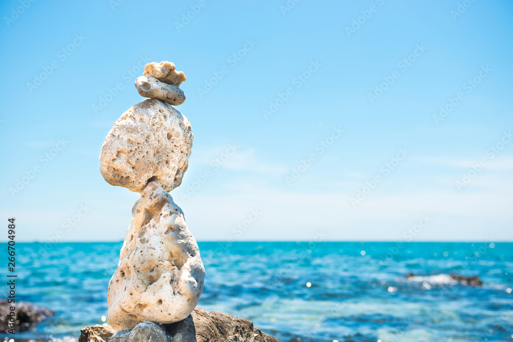 Zen stones balance at sea background Zen stones balance at sea background