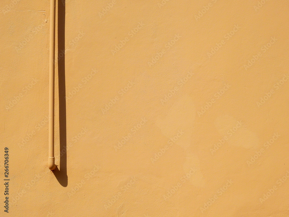 pipe with shadow on brown wall background, minimalism style