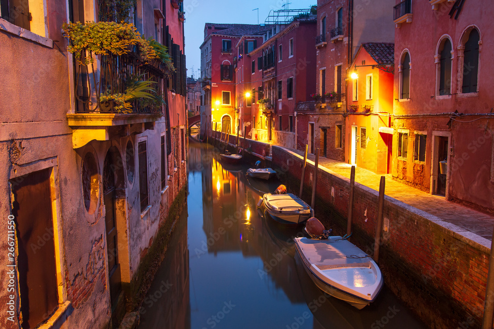 Venice at night. Boats in canal street houses in water. Venice cityscape, Italy