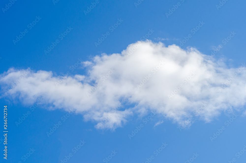 fluffy white cloud on a summer blue sky. Background