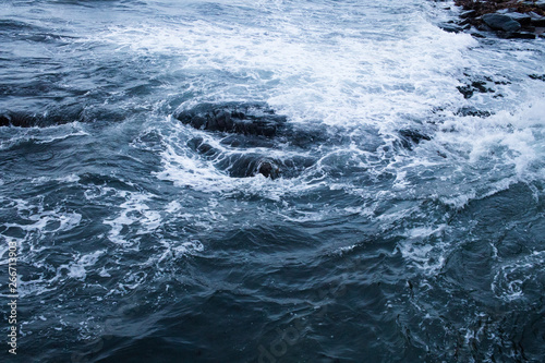 Dark blue nothern ocean waves in winter. Water surface