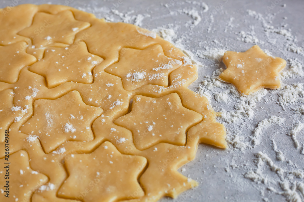 Dough. The process of making cookies and gingerbread at home. Star shaped cookies