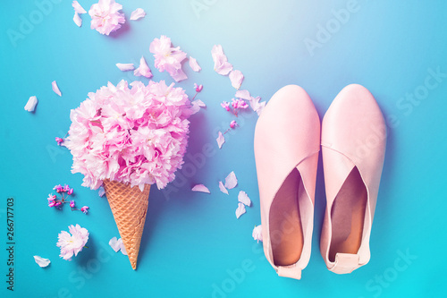 concept of girl dreams of pins ice cream and fashionable shoes on blue colorful background