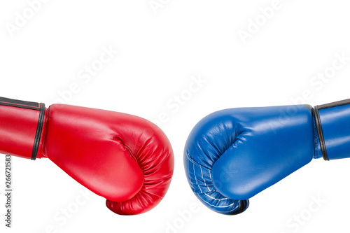blue and red boxing gloves are moving at each other for a kick, business concept and destruction, on a white background, isolate © aneduard