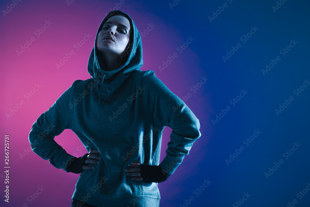 Sportswoman in hooded sweatshirt Sportswoman in hooded sweatshirt