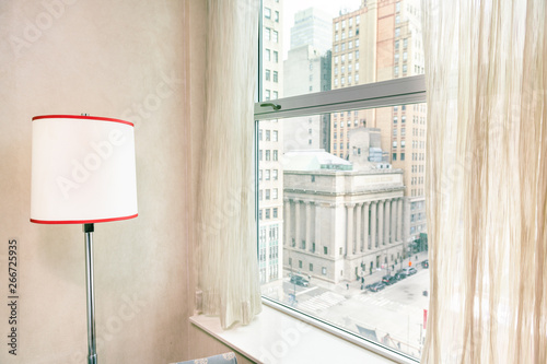 Retro red lamp by window view midtown New York City NYC cityscape in Manhattan hotel apartment condo high rise building