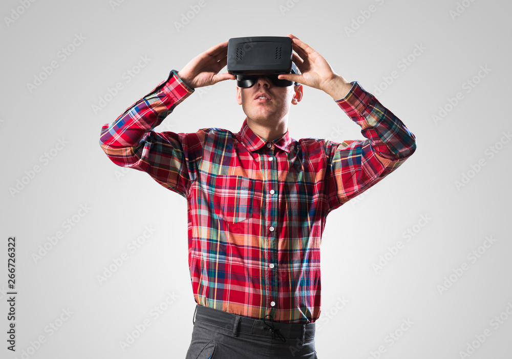 Guy in mask experiencing virtual reality as new entertainment device Guy in mask experiencing virtual reality as new entertainment device