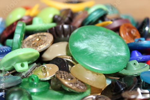 A lot of multicolored different size old buttons