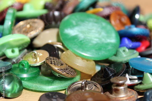 A lot of multicolored different size old buttons