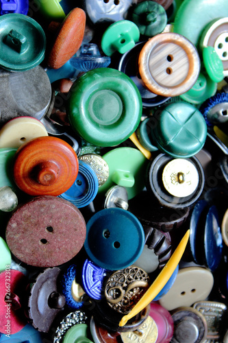 A lot of multicolored different size old buttons