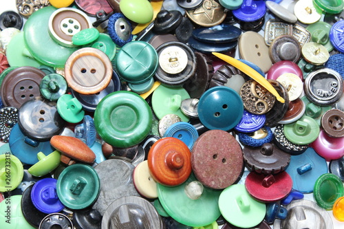 A lot of multicolored different size old buttons