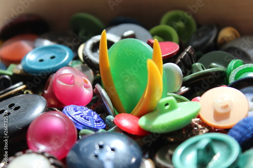 A lot of multicolored different size old buttons