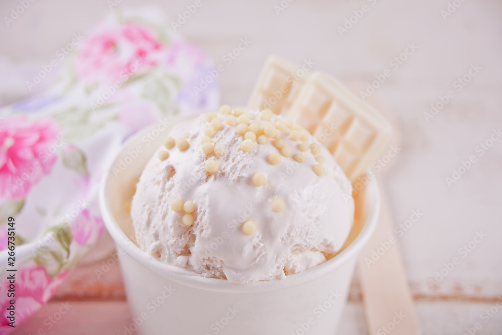 Vanilla ice cream with white chocolate on the white background. Vanilla ice cream with white chocolate on the white background.