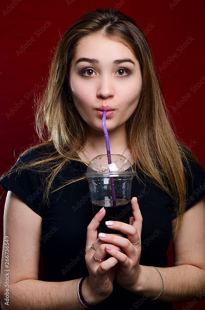 portrait of a girl with a cocktail in the Studio portrait of a girl with a cocktail in the Studio