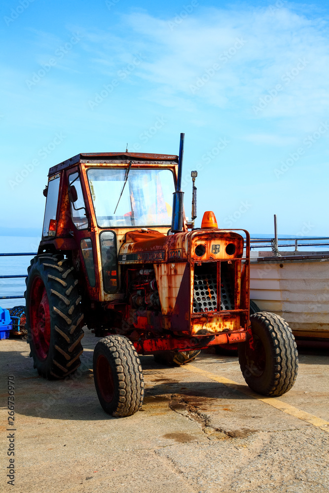 Filey England UK June 1 2018 Old rusty tractor used for towing the fishing boats from The cobble landing Filey North Yorkshire - Editorial
