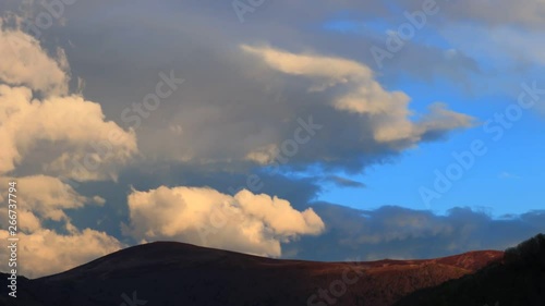 Timelapse of moving clouds at sunset in Pyrenean, Aude in the south of France photo