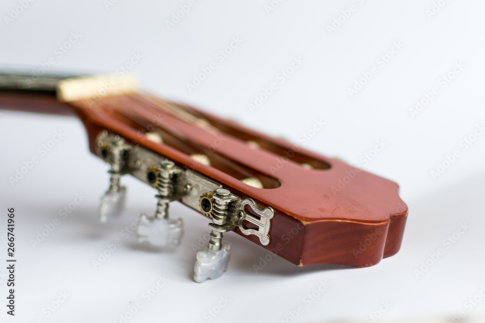 Classic acoustic guitar on white background view.
