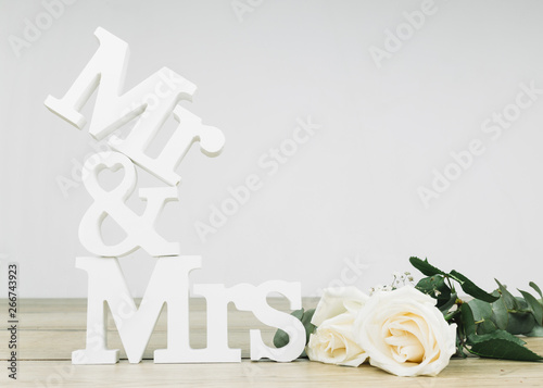 Mr and mrs with white roses photo