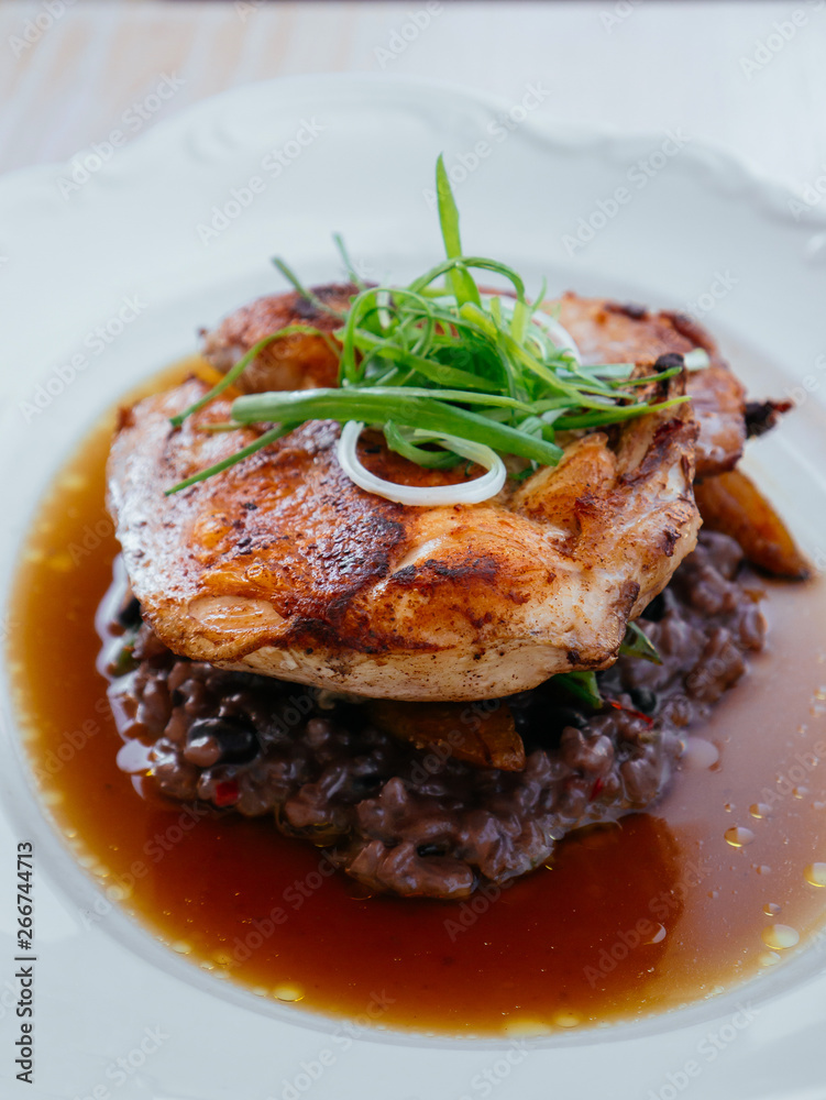Grilled Chicken spicy breast with brown Risotto in broth Grilled Chicken spicy breast with brown Risotto in broth