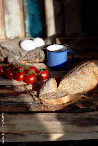 country breakfast with bread, tomato and egg