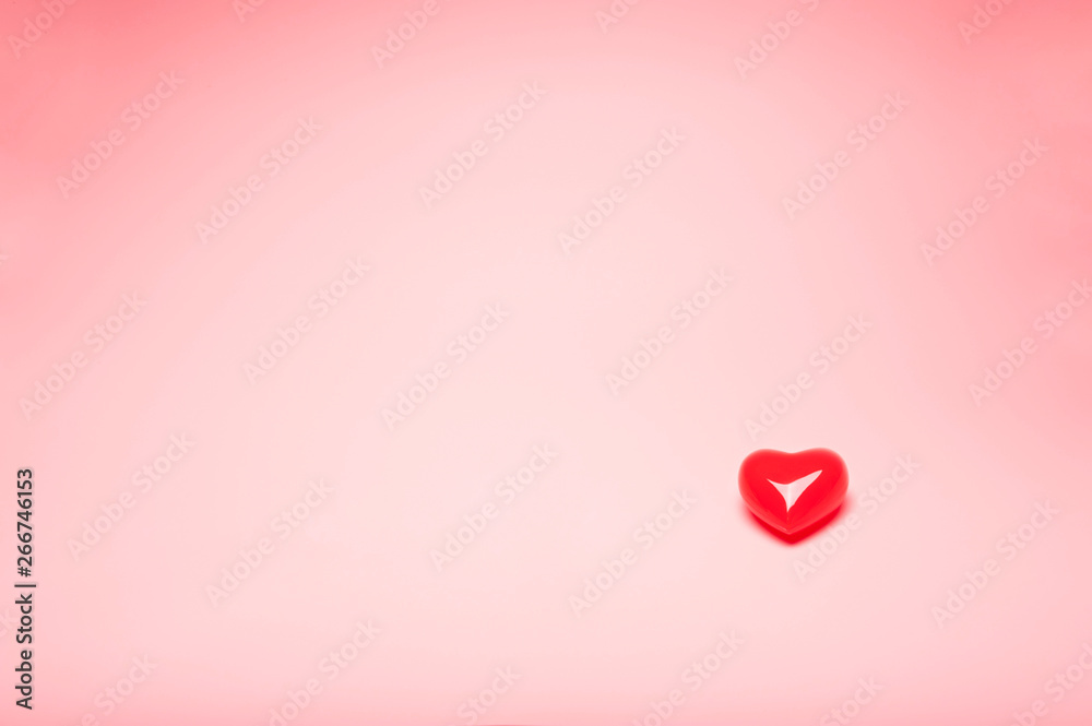 Red valentine heart model on pink background with texting space