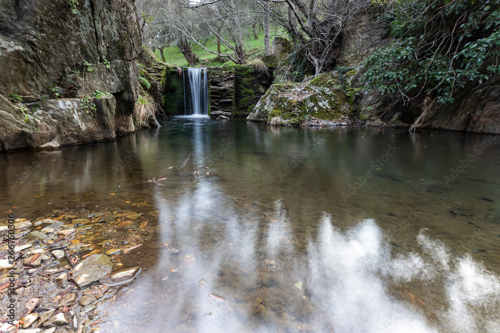 waterfalls in a old abandoned mine in extremadura dehesa
