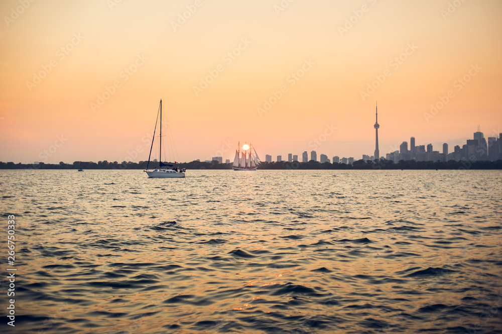 A hazy summer sunset over Toronto harbour