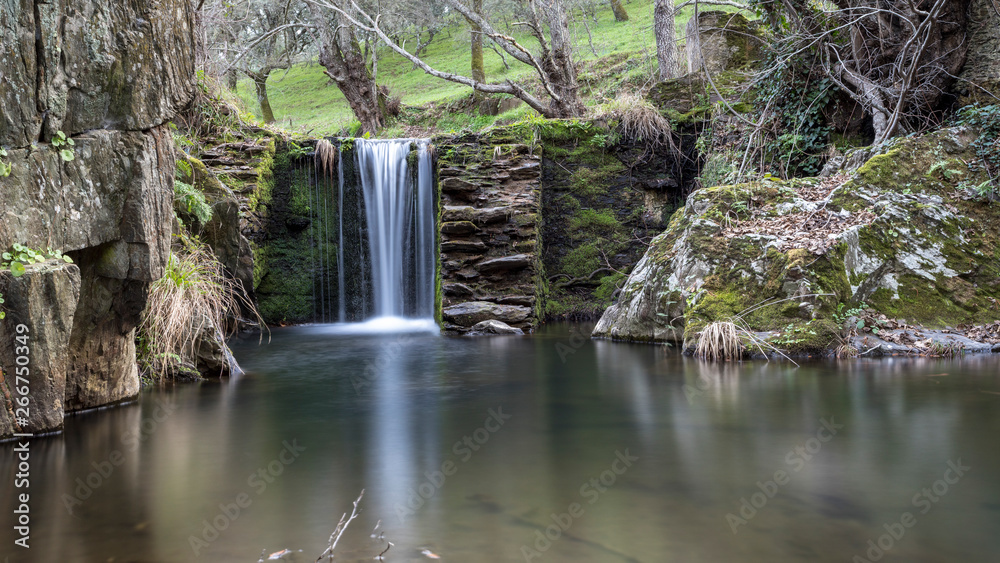 waterfalls in a old abandoned mine in extremadura dehesa