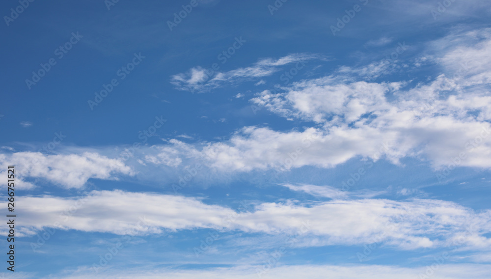 wide angle blue sky with white clouds