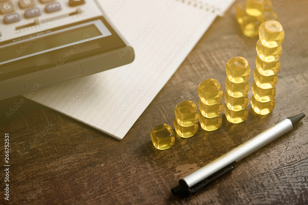 concept business calculator pen note book yellow dice resemble profit graph concept business calculator pen note book yellow dice resemble profit graph