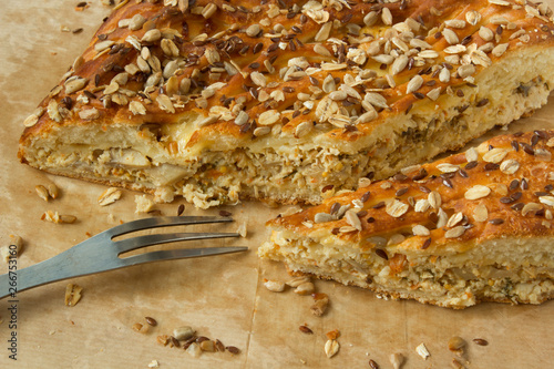 Wallpaper Mural Tasty sliced pie with seeds and grains on top and fork on parchment paper Torontodigital.ca