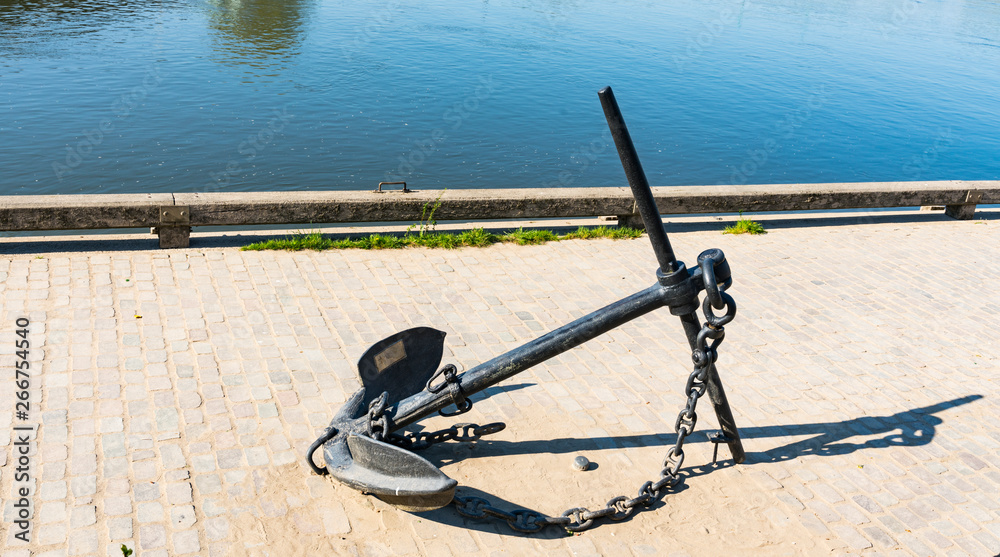 River IJssel with anchor on the embankment in Deventer, The Netherlands River IJssel with anchor on the embankment in Deventer, The Netherlands