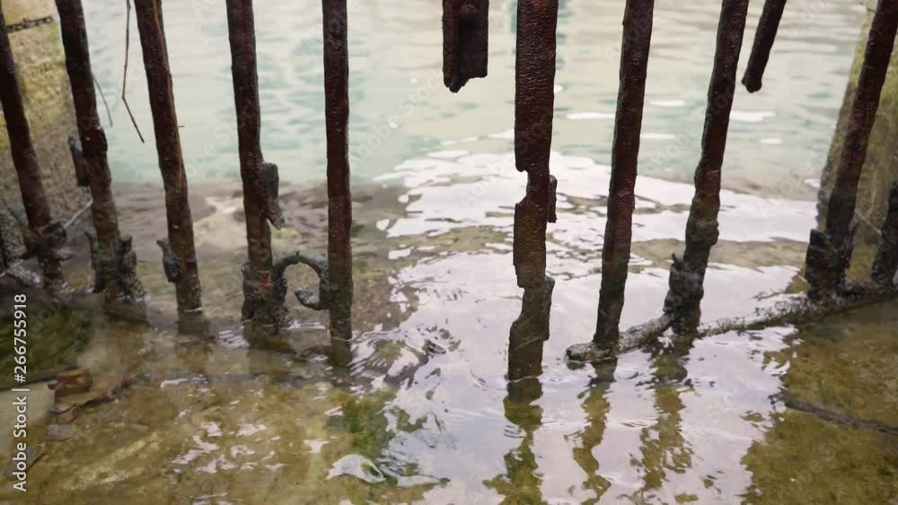 Image of salty water rusting old gate, Venice, Italy. Image of salty water rusting old gate, Venice, Italy.