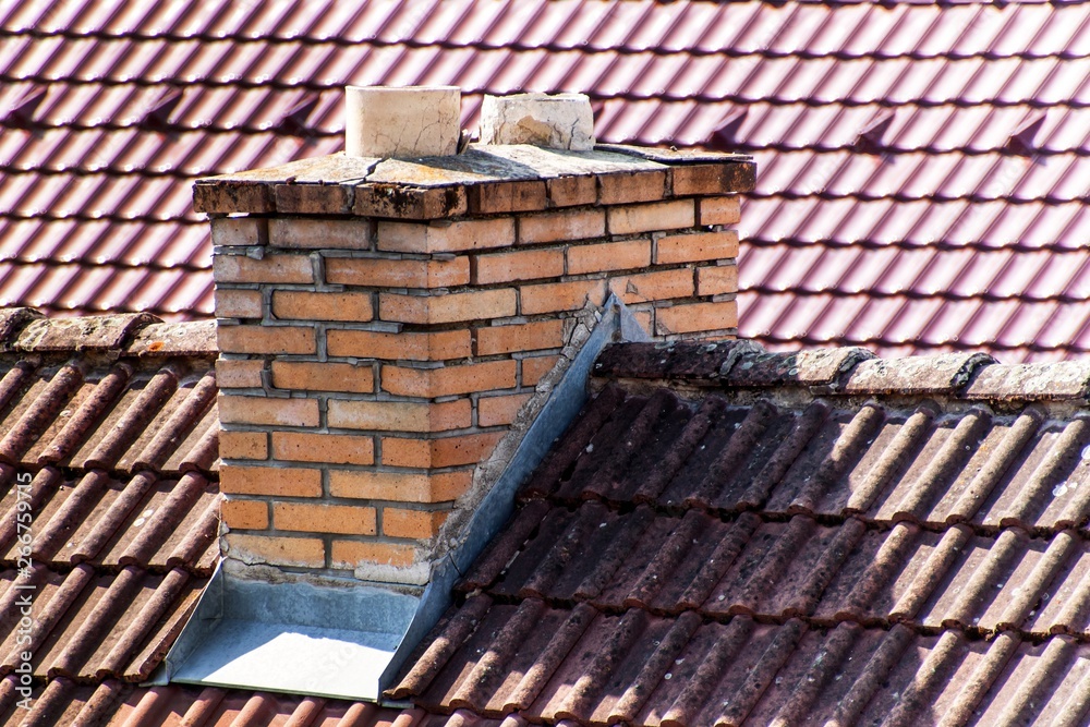 Old brick chimney. Ecology concept. Heating with coal. Ecological heating of the family house. Old brick chimney. Ecology concept. Heating with coal. Ecological heating of the family house.