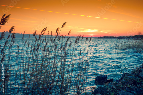 Early morning, sunrise over the lake. Garda lake (Lago di Garda), Italy, Europe