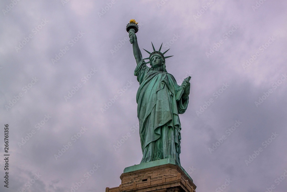 Nice view on isolated Statue of Liberty New York. Beautiful backgrounds.		