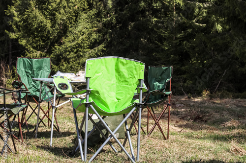 Picnic in the mountains. Folding chairs. Offroad on the Jeep in the Carpathian Mountains