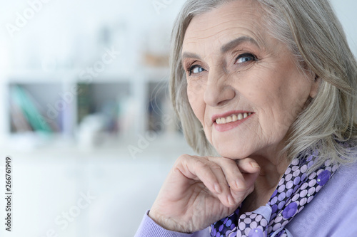 Close up portrait of happy senior woman posing