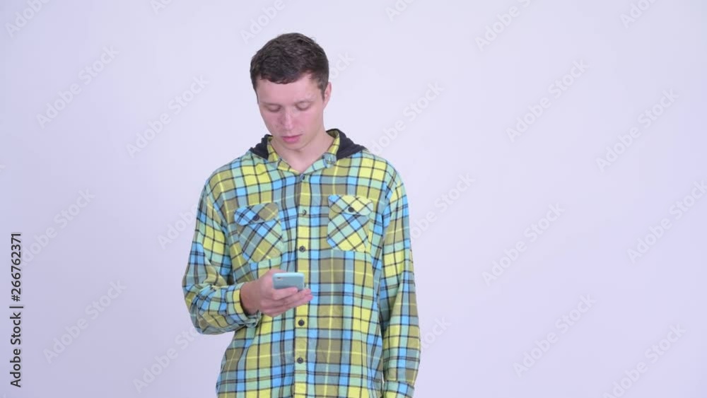Confused young man using phone and searching something Confused young man using phone and searching something