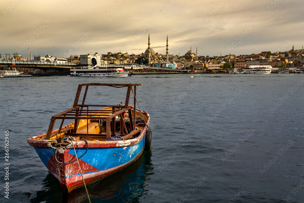Fototapeta premium Istanbul landscape, small boat sea, mosque and Galata Bridge