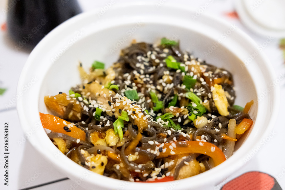 Buckwheat noodles with chicken and vegetables in Japanese style Buckwheat noodles with chicken and vegetables in Japanese style