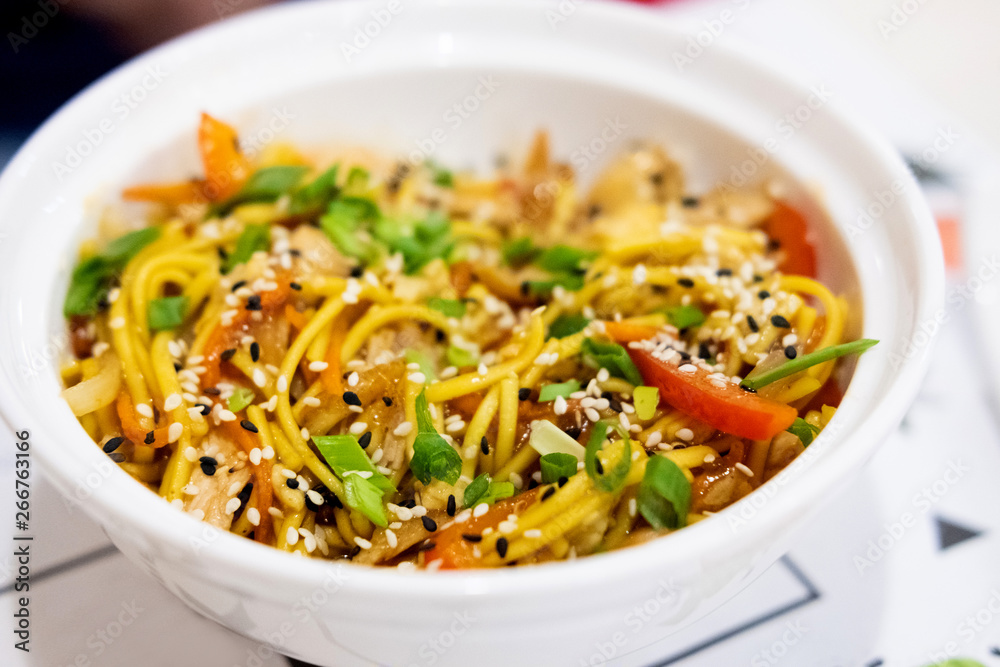 Udon noodles with meat and vegetables in an Asian style Udon noodles with meat and vegetables in an Asian style