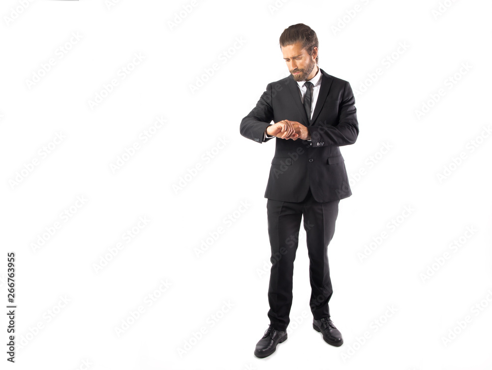 Man with abun wearing a suit posing  in a studio