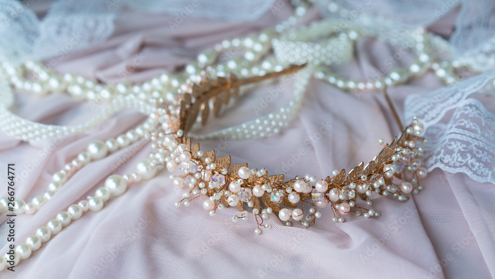Wedding background with pearls and hair accessories on pink background Wedding background with pearls and hair accessories on pink background