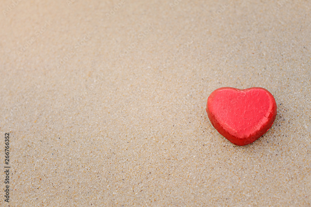Chocolate color Lovely red heart on the beach. Background is a natural in real place, creative Valentine's Day Concept, tropical style background made in Phuket, Thailand. Chocolate color Lovely red heart on the beach. Background is a natural in real place, creative Valentine's Day Concept, tropical style background made in Phuket, Thailand.