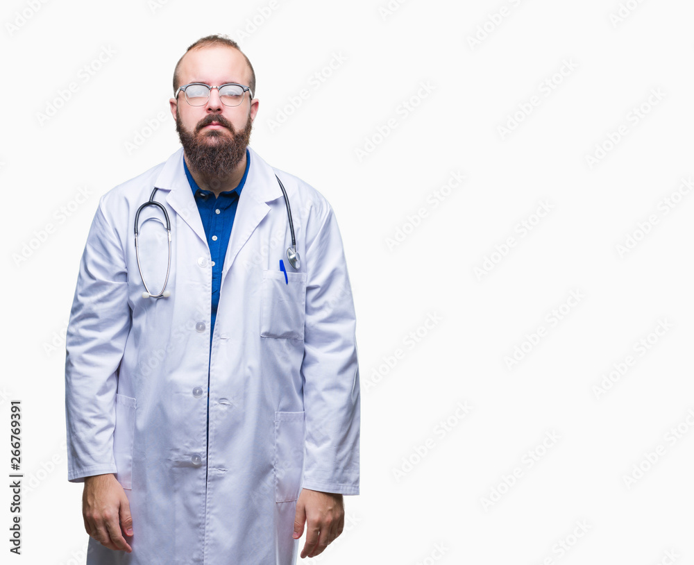 Young caucasian doctor man wearing medical white coat over isolated background with serious expression on face. Simple and natural looking at the camera. Young caucasian doctor man wearing medical white coat over isolated background with serious expression on face. Simple and natural looking at the camera.