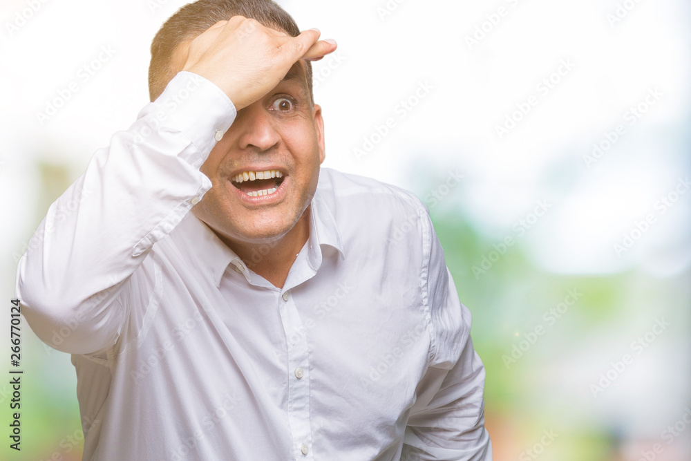 Middle age arab elegant man over isolated background very happy and smiling looking far away with hand over head. Searching concept. Middle age arab elegant man over isolated background very happy and smiling looking far away with hand over head. Searching concept.