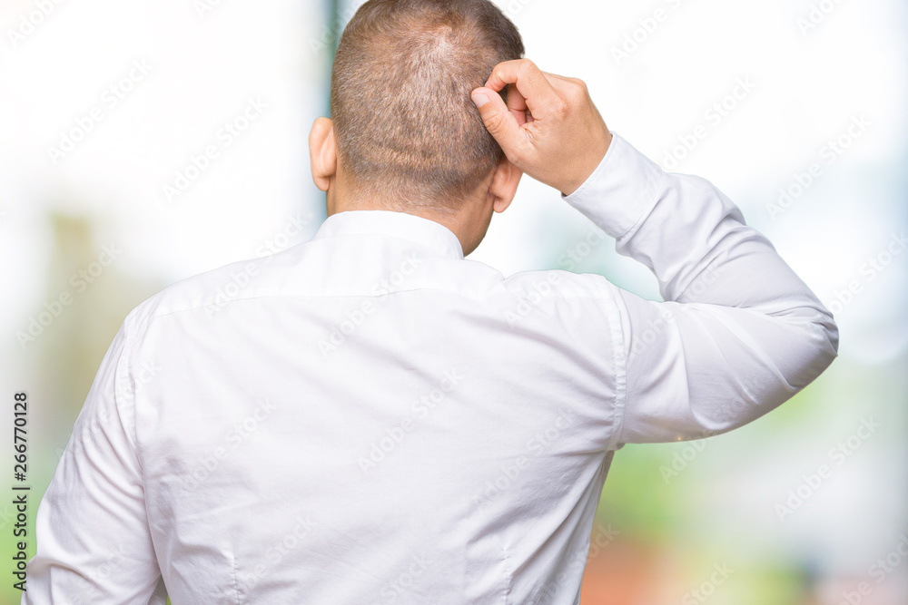 Middle age arab elegant man over isolated background Backwards thinking about doubt with hand on head Middle age arab elegant man over isolated background Backwards thinking about doubt with hand on head