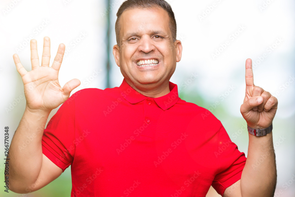 Middle age arab man over isolated background showing and pointing up with fingers number six while smiling confident and happy. Middle age arab man over isolated background showing and pointing up with fingers number six while smiling confident and happy.