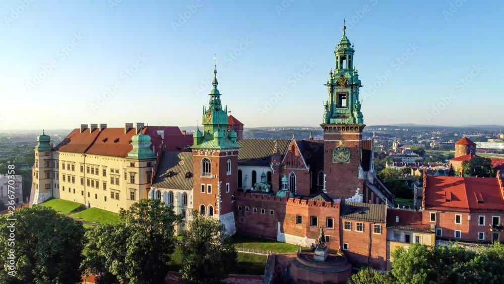 Krakow, Poland. Wawel Gothic Cathedral and belfry with the famous Sigismund Bell (Dzwon Zygmunta) at renaissance castle. Aerial 4K approaching video in sunrise light Krakow, Poland. Wawel Gothic Cathedral and belfry with the famous Sigismund Bell (Dzwon Zygmunta) at renaissance castle. Aerial 4K approaching video in sunrise light
